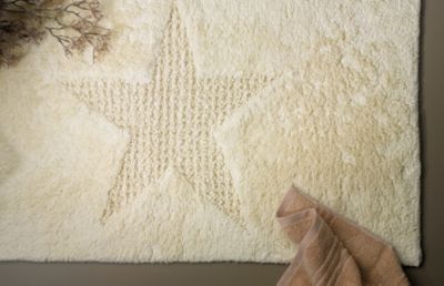 Modern Lindano bath mat with woven-in star design